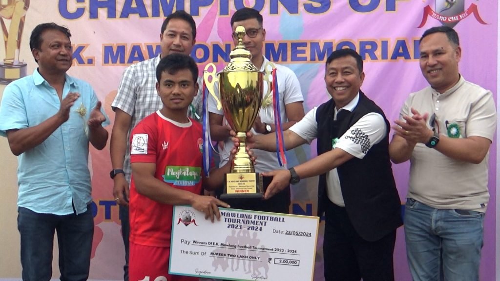 RYNGKAT KI BAHAING U (L) BAH EK MAWLONG BAD KI NONGSHAH KHOT SNGEWBHA LA PYNHAP PYRDA IAKA EK MAWLONG MEMORIAL TROPHY FOOTBALL TOURNAMENT HA MAWLASNAI