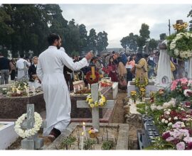 All Souls’ Day, a solemn occasion dedicated to praying for the departed, was observed with deep reverence across the Shillong Archdiocese on Sunday. The Mother Parish of Laitumkhrah, the central parish of the Archdiocese, witnessed particularly large gatherings as the faithful came together in prayer and remembrance. Hundreds of believers offered prayers, laid flowers, and lit candles at the cemetery, paying tribute to deceased family members, friends, and all the departed faithful. The faithful sought God’s mercy and eternal peace for their souls. A Holy Mass at the Grave Yard of Laitumkhrah Parish was presided over by Most Rev. Victor Lyngdoh, Archbishop of Shillong, who served as the main celebrant. In his homily, Archbishop Lyngdoh reflected on the spiritual meaning of All Souls’ Day and called upon the faithful to contemplate eternal life and the hope found in God. “Our prayer today is not only to remember those who have gone before us, but also to renew our hope in God, who grants us eternal life,” Archbishop Lyngdoh said. He urged families and communities to continue practicing acts of love, prayer, and remembrance as expressions of unity with the souls of the departed. All Souls’ Day remains an important tradition in the Catholic Church, emphasizing prayers for the souls in purgatory so that they may attain eternal rest in God’s presence. Following the Mass, Archbishop Lyngdoh led a special prayer service and blessed the graves, as the congregation joined in solemn devotion to honor and remember their loved ones who have passed on.